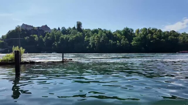 Scenic Boat Ride Towards Rhine Falls in Switzerland. 