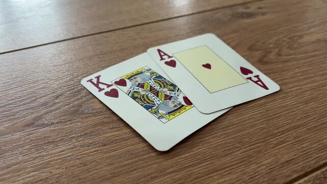 Blackjack Playing Cards Dealt on a Wooden Table for Casino Game