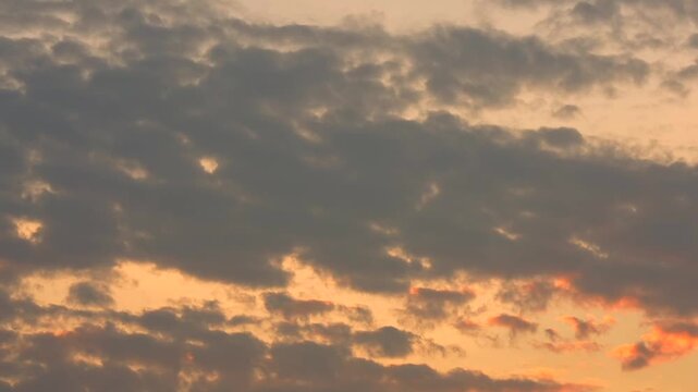 Timelapse Vibrant cloud formations transform into a spectacular gold natural background