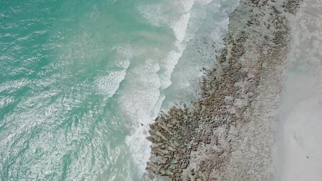 Turquoise Ocean Waves Meeting Sandy Beach Near Broome