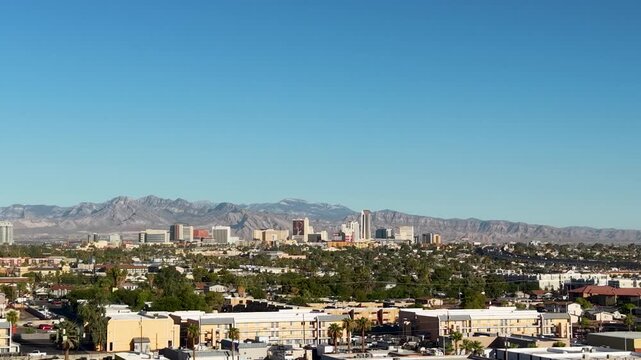 As the drone orbits the suburban neighborhood surrounding Las Vegas we see the skyline of Old Downtown Vegas. A slow pan across the sky reveals the growth of Sin City.