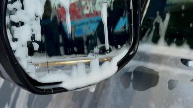 Car Side Mirror Covered with Foam During Automatic Car Wash