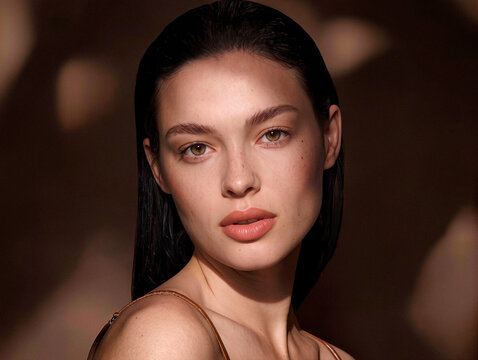 Portrait of a Young Woman with Natural Beauty in Warm Tone. AI generated