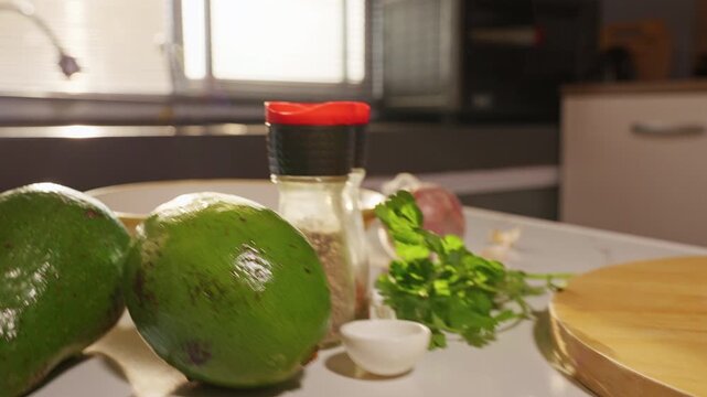 Large Ripe Green Avocado Rests beside Kitchen Knife on Wooden Board, Fresh Ingredient for Healthy Homemade Cooking