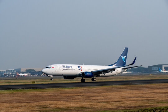Jakarta, Indonesia - July 15, 2026: BBN Airlines Indonesia Boeing 737 landing on the runway at Soekarno-Hatta International Airport.