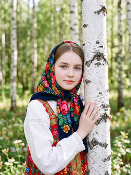 Portrait of a young beautiful woman with a scarf on her head