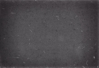 Fototapeta premium Old grunge monochrome filmstrip texture. Blank grained film strip texture background with heavy grain and dust 