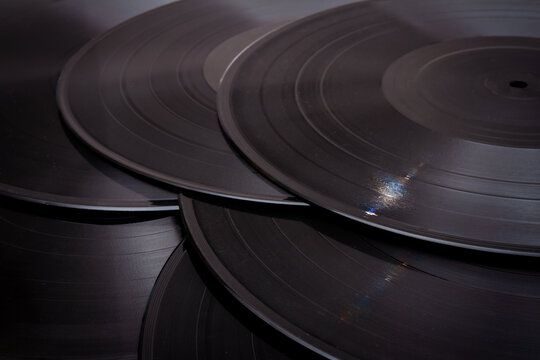 Group of black vintage records. Vinyl records texture, music background. View of phonograph records.
