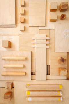 Flat lay of various wood and plywood pieces. Carpentry background.