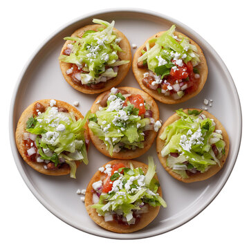 Traditional mexican sopes with refried beans, crema, queso fresco and vegetables isolated on transparent background. Dish on the plate for menu, cafe, design.
