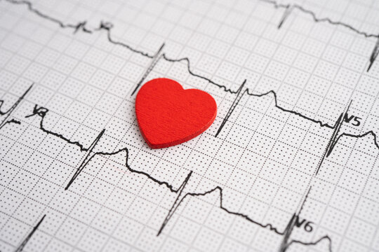 Red heart on electrocardiogram ECG with red heart, heart wave, heart attack, cardiogram report.