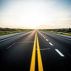 Obraz premium A long empty asphalt road stretching towards the horizon at golden sunset