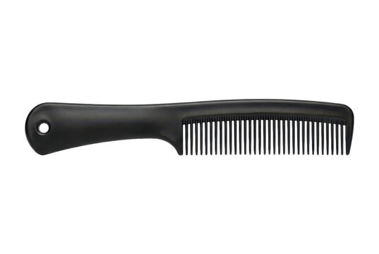Black wide tooth comb isolated on black background.