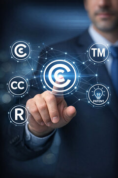 Hand touching copyright icons with digital network