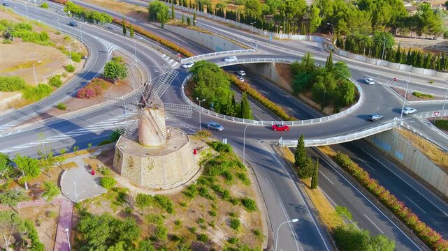 Bird's eye view of the Old Stone Mill near the ring road during a magical sunset. Santa Ponsa, Palma de Mallorca, Spain.