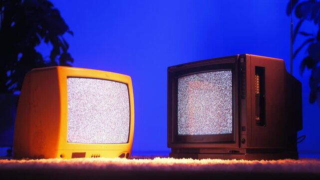 Retro TV, vintage television In a nostalgic setup, a retro TV displays grain on screen, scary halloween night device good for chroma key and green screen.