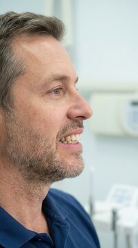 A contemplative profile portrait of a mature man