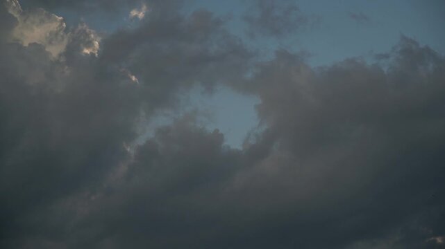 Dynamic Time lapse of Changing Clouds Against a Blue Sky During Golden Hour