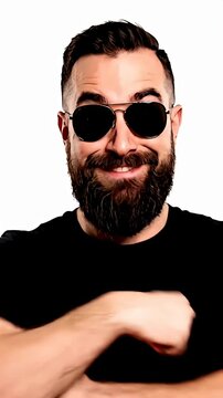 Bearded man wearing sunglasses in black shirt.