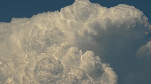 Timelapse of a billowing storm rain clouds creating a very dramatic scene.
