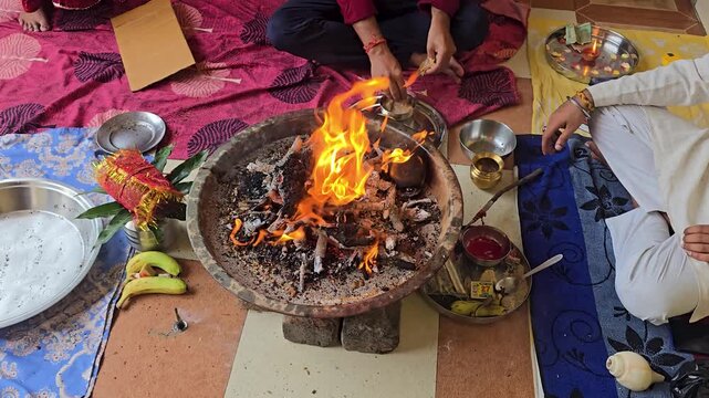 Hindu ritual fire ceremony with sacred offerings a wide angle shot of a burning in a havan kund