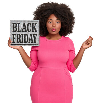 Plus-size Black woman with voluminous afro hair in a pink dress blowing a kiss and holding a glittery Black Friday sign against isolated on transparent or white background, png