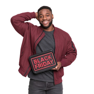 Smiling Black man in a maroon bomber jacket holding a red neon Black Friday sign against isolated on transparent or white background, png