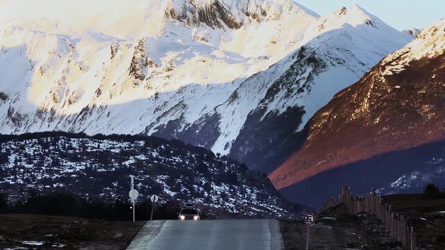 Car Driving Along Mountain Road Toward Camera in Ushuaia, Argentina - 4K
