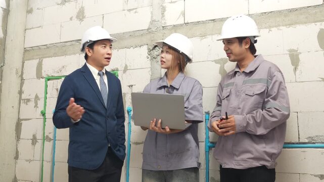 Construction inspectors and engineer discussing project details at an unfinished building site, teamwork, communication, safety compliance, site supervision, safety, construction project management.