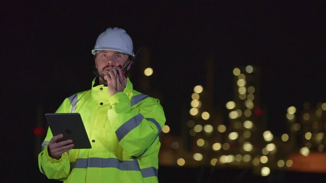 Engineers&rsquo; night shift working oil and gas refinery service, Workers hard work at night petroleum industry plant background, Oil and Gas Petrochemical industry.