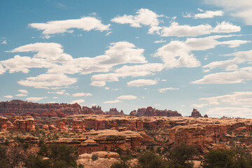 Clouds drift above rocky landscapes in Canyonlands National Park, in Utah © LB Photo Co