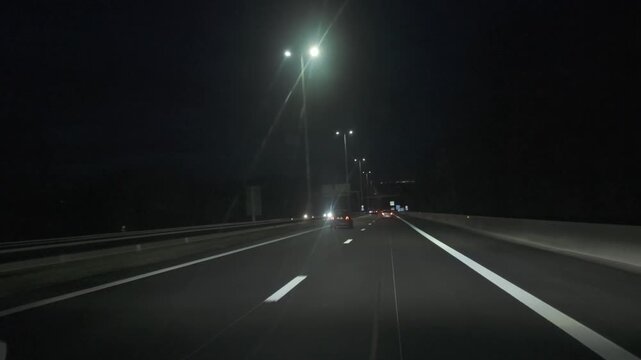 First-Person View of Driving on an Illuminated Highway at Night