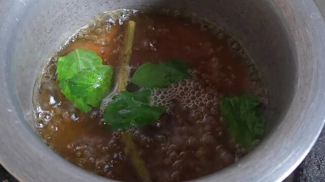 Giloy and tulsi kadha sweetened with jaggery and spiced with black pepper builds strong immunity, reduces inflammation, detoxifies the liver, clears respiratory congestion, and cures seasonal flu.