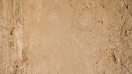 Fototapeta premium Weathered plaster texture with soft warm shadow, muted clay tone, tactile surface detail visible