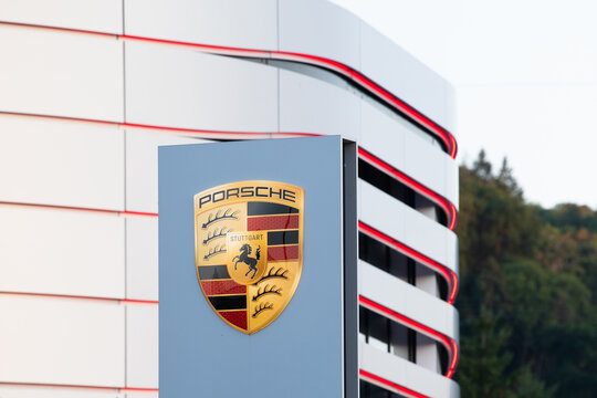 Porsche brand logo, german car automobile manufacturer, profit collapse of industry in Trier, Germany
