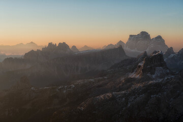 Breathtaking mountain peaks silhouetted against a colorful dawn sky. Ideal for adventure travel themes, meditation backgrounds, and outdoor lifestyle branding. © marcodenaro