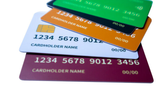Angled stack of multi-colored credit and debit cards on a white background