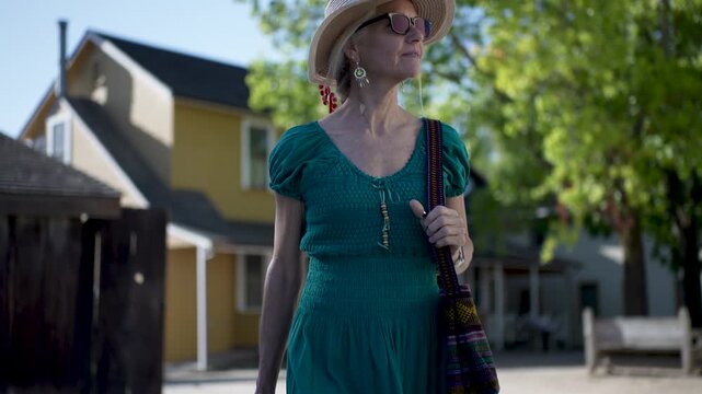 Senior woman explores Casa Grande while learning about history in Sonoma, California during a bright morning just after sunrise.