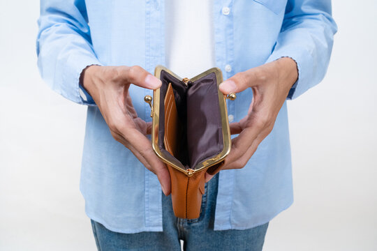 Close-up of Asian woman hands opening an empty wallet on white background. Concept of financial crisis, running out of cash, inflation, and debt.