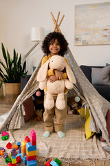 Joyful moments of a young boy exploring creativity at home © LIGHTFIELD STUDIOS