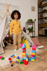 Joyful african american boy enjoys playtime in a bright modern home © LIGHTFIELD STUDIOS