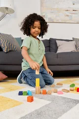 Fotobehang Lego Joyful moments of a boy building with colorful blocks at home  © LIGHTFIELD STUDIOS