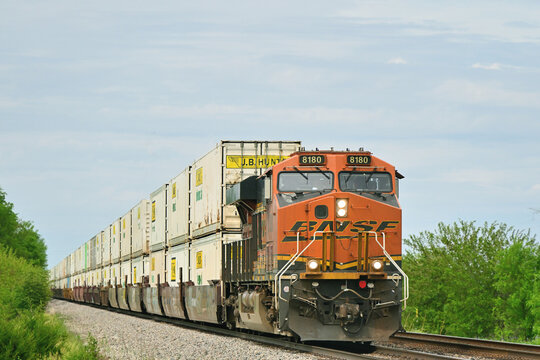 A single Burlington Northern Santa Fe locomotive umit leads an eastbound intermodal freight train through a rural section of north central Illinois.