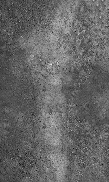 Full frame dark charcoal concrete background featuring a dense exposed aggregate surface with deep charcoal speckling and rough stone grit for sleek industrial interior spaces.