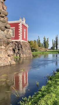 Woerlitz Garden Kingdom, Germany, artificial grotto with a building and a pond