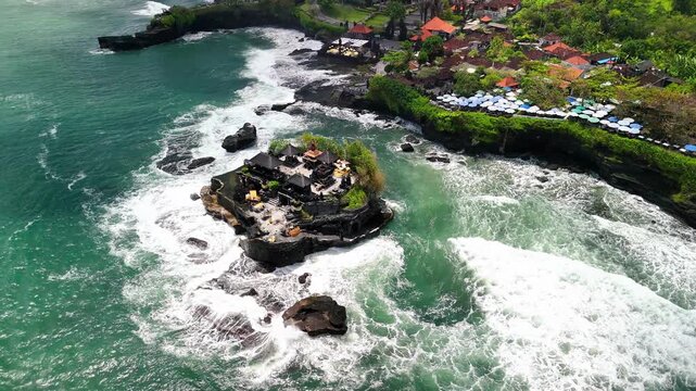 Drone footage of Pura Batu Bolong and Tanah Lot during
