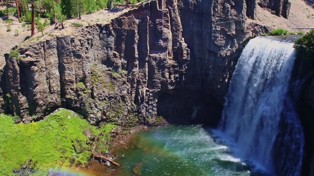 Sweeping view captures Rainbow Falls cascading near Devils Postpile National Monument in Mammoth Lakes