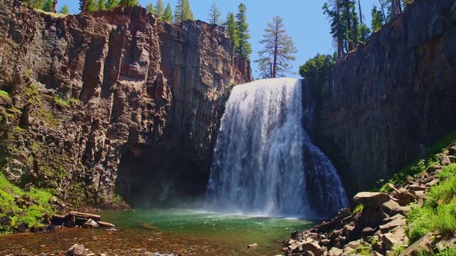 Sweeping view captures Rainbow Falls cascading near Devils Postpile National Monument in Mammoth Lakes