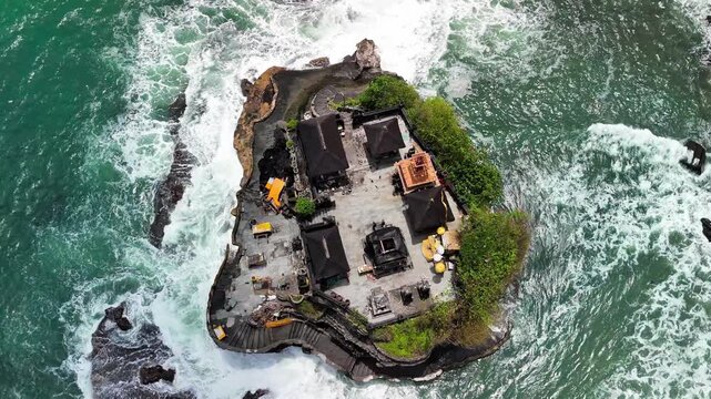 Panoramic drone shot of Tanah Lot Bali temples surrounded