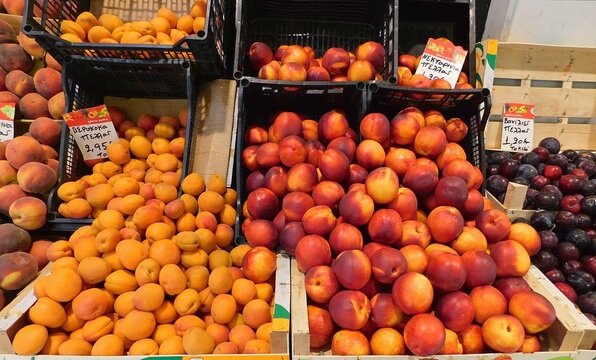 Peaches, apricots, nectarines and greengages on a fruit stand in Greece